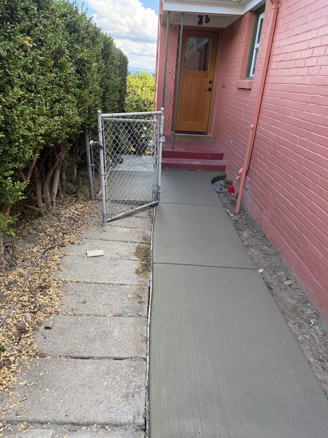 Finished broom-finished concrete walkway completed by Peak Stone Concrete